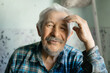 © Parilov - Portrait Elderly caucasian male smiling in plaid shirt at home