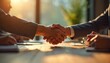 © Viktor - Business people shake hands at meeting. Partnership concept in finance sector. Two men shaking hand. Agreement between firms on bright sunset window background. Corporate collaboration at