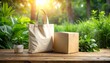 © andre - Eco-friendly shopping essentials Tote bag and cardboard box in nature with a small potted plant