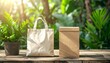 © andre - Sustainable Shopping Canvas Bag and Box on Wood with Green Plants