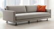 © Kiki - Sleek grey modern sofa in apartment with orange pillow accent design