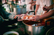 © kuarmungadd - The hand of a beggar received food from a compassionate person, Concept of sharing