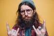© VolumeThings - A young hipster with long hair and glasses displays a negative gesture with crossed fingers