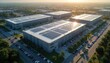 © Pete - Large modern data center campus with solar panels on rooftops. Buildings arranged in a row, vast parking lots filled with cars, surrounded by green trees and clear sky.