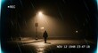 © muhammad - A lone figure walks down a dimly lit street at night, shrouded in fog and illuminated by a street lamp