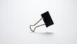 © Jaka Wardana - Black Binder Clip on White Background