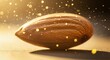 © Zumroatun - A single almond nut with a golden glow and shimmering particles floating around it.
