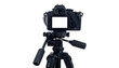 © Albashirah - A professional camera mounted on a tripod, back view, with a blank screen, against black