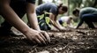 © Ophelia - Community effort in environmental conservation with people planting trees in forest setting