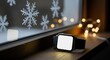 © ZHMPRO - Smartwatch with blank screen on windowsill with snowflakes and bokeh lights, winter holiday theme