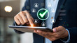 © Sabbir Digital - Man using tablet with security checkmark, ensuring data protection online