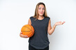 © luismolinero - Young basketball caucasian player woman isolated on white background having doubts while raising hands