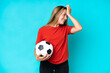 © luismolinero - Young football player woman isolated on blue background has realized something and intending the solution