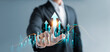 © Thapana_Studio - Business and finance growth concept, businessman touching virtual graphs, analyzing financial data, investment strategies and digital marketing for economic planning, long-term development goals.