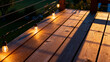 © Zephyr - String lights glowing warmly on a wooden deck at dusk, casting long shadows across the planks.