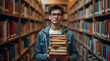 © Aliaksandr - A young man holds a stack of books in a library. Focused student with study material.