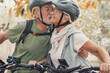 © Daniel - Couple of cute and sweet seniors in love enjoying together nature outdoors having fun with bikes. Old man kissing his wife smiling and feeling good.