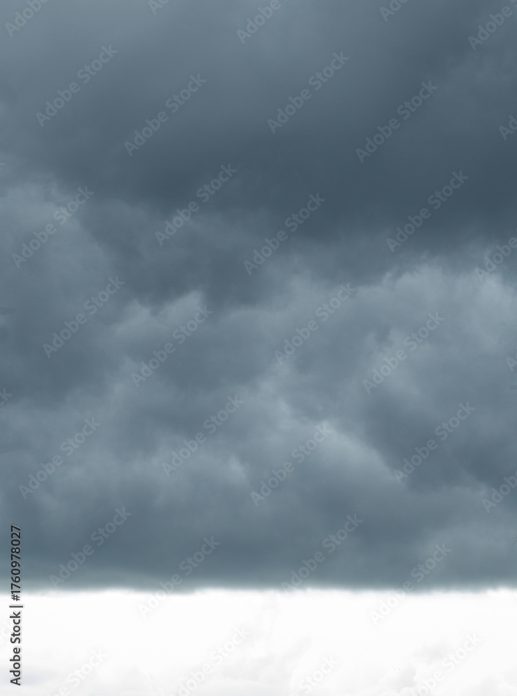 Dark storm clouds gathering before heavy rain. Moody dramatic sky with ...