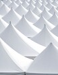 © Kursi - Aerial view of many white conical tents, creating a repeating pattern