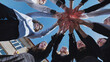 © Довидович Михаил - Students forming a circle and holding hands to represent unity, teamwork, and school community spirit