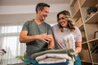 © milanmarkovic78 - Couple Doing Laundry