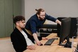 © dsheremeta - Business colleagues collaborating on computer project in office