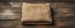 © Anastasija - A neatly folded piece of coarse burlap fabric natural, rustic, breathable, perfect for crafts,