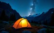 © wu - Camping adventure in the mountains. A tent pitched up and glowing under the milky way. Photo composite. High quality