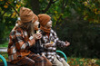 © alexkich - Children Enjoying Autumn in Warm Plaid Clothing Outdoors