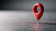 © irawan - Red location pin marks a spot on a grid surface.
