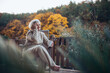© Halfpoint - Portrait of smiling elderly lady relaxing on terrace during warm autumn day.