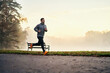 © baranq - Active man running on foggy morning during autumn