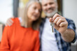 © zinkevych - Mature couple holding keys of new house standing outdoors near entrance