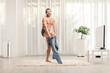 © Ljupco Smokovski - Naked man in underwear putting on a pair of jeans