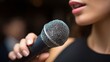 © admin_design - Professional woman holding microphone confidently delivering captivating speech or presentation public speaking event.
