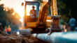 © Kateryna - Backhoe excavator digging trench for pipeline installation heavy machinery infrastructure construction equipment earthmoving operation construction site operator cab