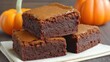 © Chatchanan - Delicious pumpkin brownies recipe home kitchen food photography autumn close-up seasonal baking