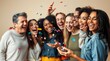 © Chom - Joyful celebration with diverse group of friends laughing and enjoying confetti in a cheerful party atmosphere