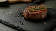 © Yana - Juicy steak with herbs resting on a dark stone plate in a modern kitchen setting
