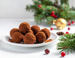 © Nata_Prando - Delicious chocolate truffles on a festive plate with holiday decorations in a cozy winter setting