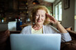 © Geber86 - Mature woman using laptop at home