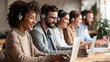 © Paula - Diverse customer support team working in call center with headsets
