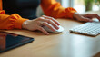 © Vadym - Woman hands using computer mouse and keyboard on wooden desk. Female worker operating laptop in office. Person typing and clicking on computer. Business woman working remotely on laptop computer.