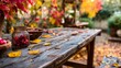 © Harry - Stunning autumn harvest display with rustic wooden table and vibrant fall foliage creating a cozy Thanksgiving atmosphere and seasonal abundance