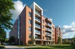 © Vadym - Modern brick apartment building exterior on a sunny summer day. Residential complex with balconies and green lawn. Contemporary urban housing with clean architecture, clear blue sky.