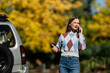 © Zoran Jesic - Woman having intense phone call after car breakdown