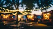 © NgocThanh - Evening Food Truck Gathering with String Lights and Tables.