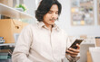 © dodotone - Generation Y southeast business asian entrepreneur masculine man using phone texting social media network