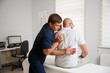 © Василь Івасюк - Chiropractor adjusting male patient’s shoulder in clinic. Physiotherapist performing manual therapy to relieve pain, improve mobility, support rehabilitation after injury or musculoskeletal disorder.