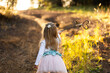 © Austockphoto - child holding homemade magic wand made of gum nuts off on an adventure through bushland
